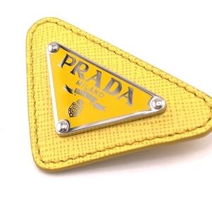 PRADA Enameled Triangle Logo Pin 💛